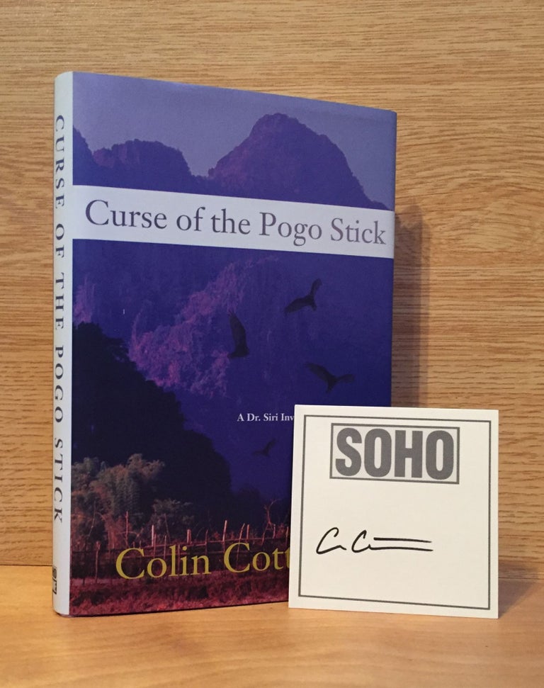 Item #900425 Curse of the Pogo Stick - Dr. Siri Palboun Mystery #5 (Signed). Colin Cotterill.